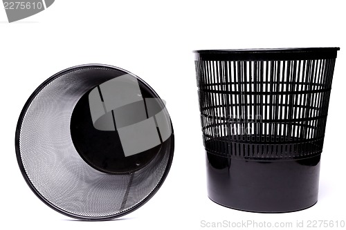 Image of A plastic trash can and a top metal trash can