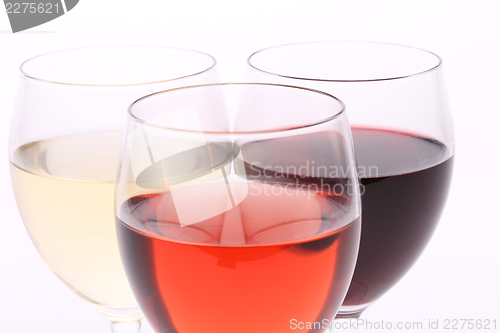 Image of three glasses with white, rose and red wine