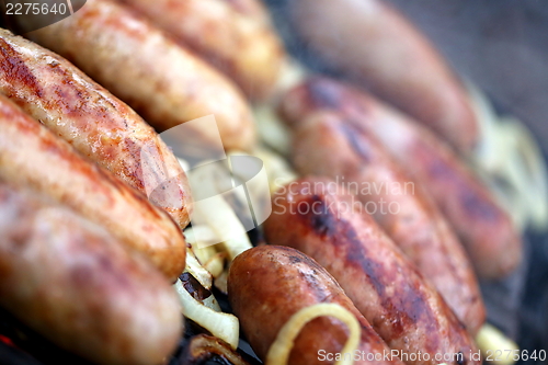 Image of Bratwurst sausages on grill.