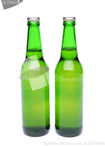 Image of Two bottles of light ale on white background.