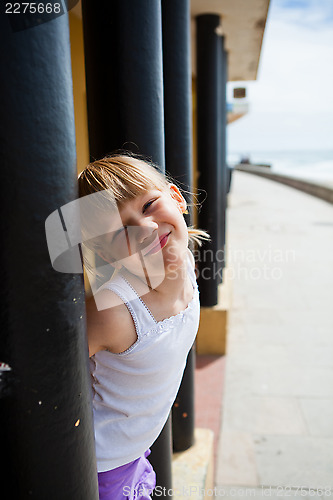 Image of Young girl on beachside walkway