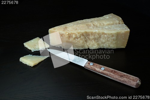 Image of italian parmesan cheese with knife