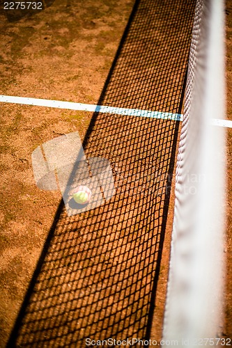 Image of tennis ball on court