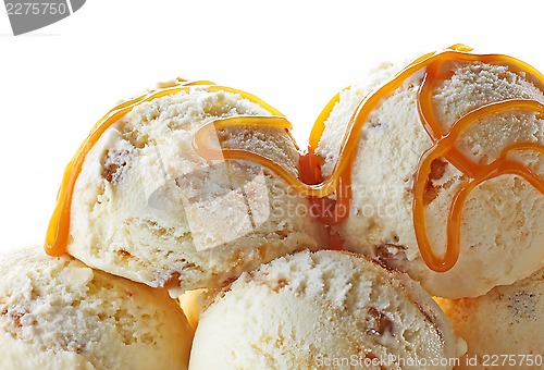 Image of ice cream balls decorated with caramel sauce