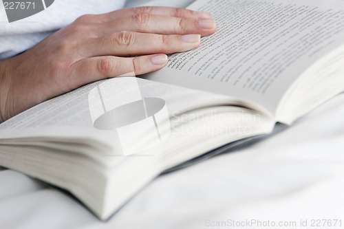 Image of Hand and Open Book