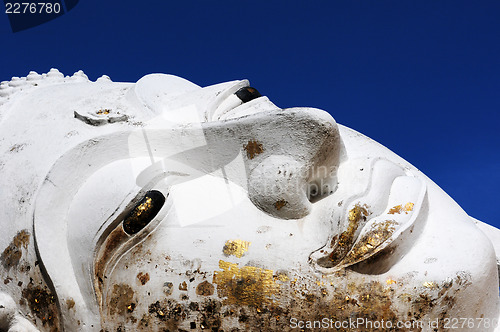 Image of Reclining Buddha face at an Ancient wat in Thailand