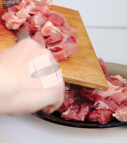 Image of cook,  cut meat