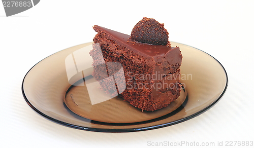 Image of piece of cake on a dark dish