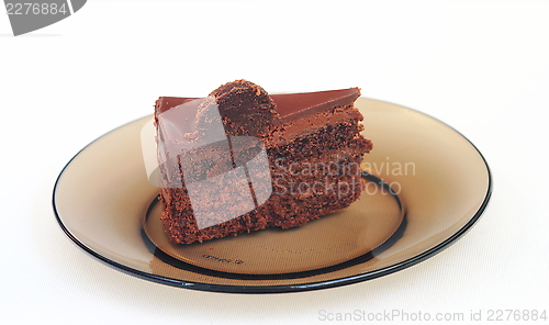 Image of piece of cake on a dark dish