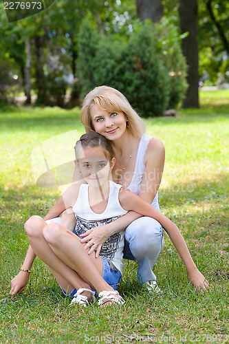 Image of Mother and daughter  is in garden