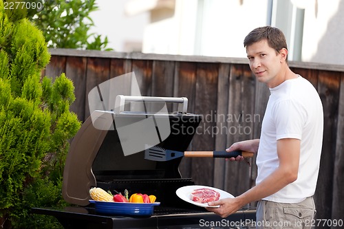 Image of man grilling food