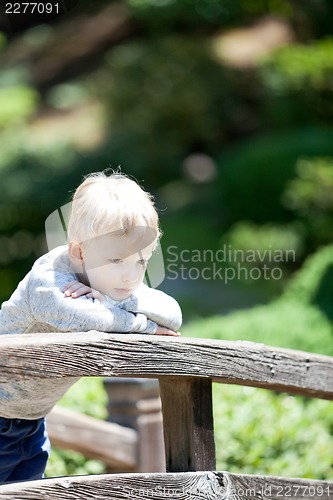 Image of sad child outdoors