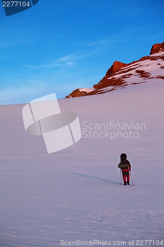 Image of Hiker in sunrise mountains