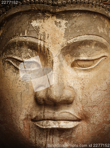 Image of Ancient stone Buddha face close up