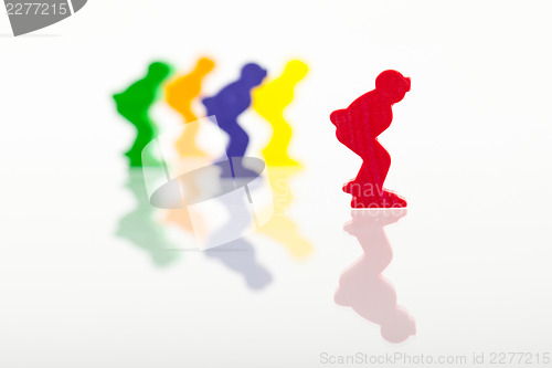 Image of Five colored pawns isolated on a white background