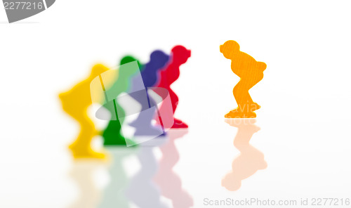 Image of Five colored pawns isolated on a white background
