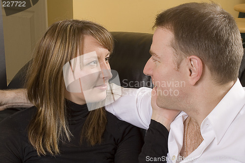 Image of couple relaxing on couch