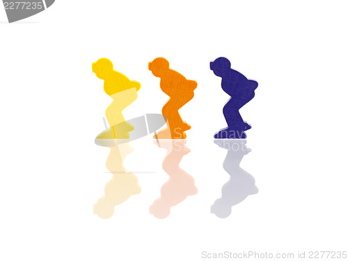 Image of Three colored pawns isolated on a white background