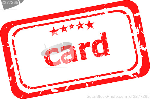 Image of card on red rubber stamp over a white background