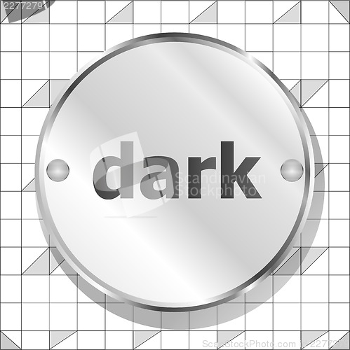 Image of dark word on metallic button