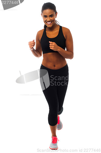Image of Fit female jogger, studio shot