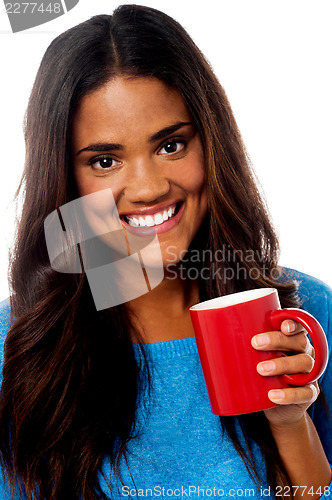 Image of Smiling woman with coffee mug