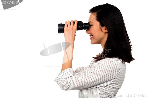 Image of Corporate woman viewing through binoculars