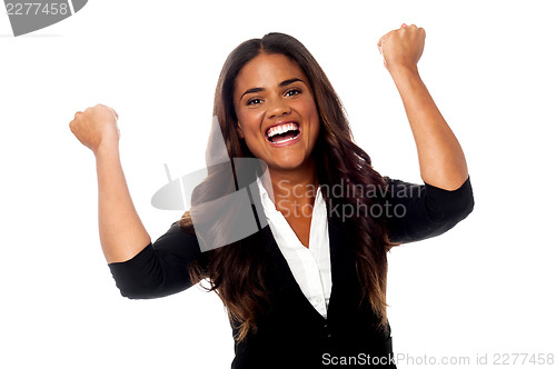 Image of Excited woman with clenched fists