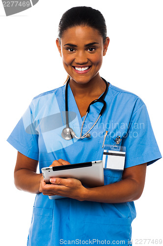 Image of Female physician holding tablet pc