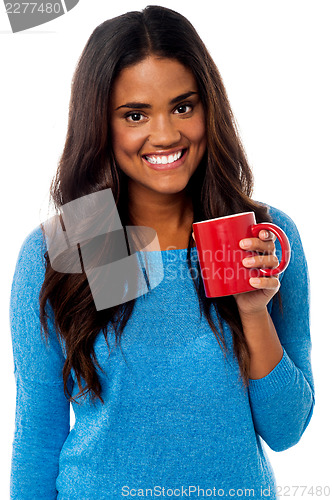 Image of You woman enjoying her morning coffee