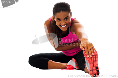 Image of Fitness girl doing stretching exercise