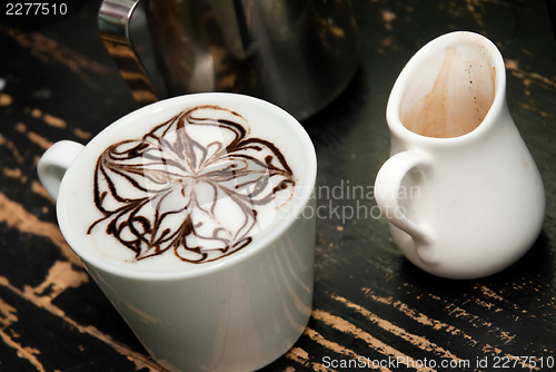 Image of coffe espresso compano cup on the black background