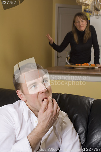 Image of couple arguing in apartment