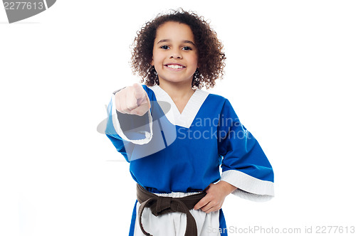 Image of Smiling karate girl pointing towards you