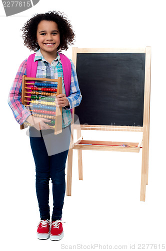 Image of School girl with abacus and pink backpack