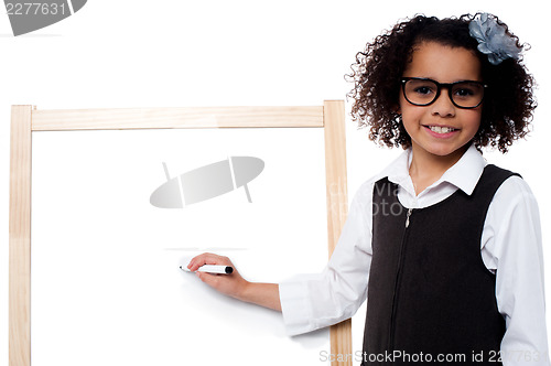 Image of Young kid about to write on whiteboard