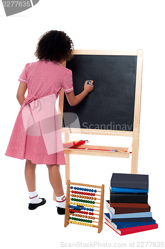 Image of Rear view of school girl in maths class