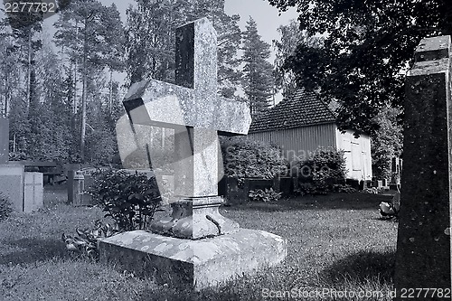 Image of Old Cross at Cemetery at Night