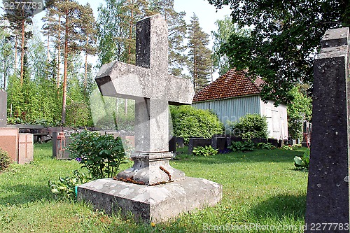 Image of Old Tombstone in Shape of Cross at Cemetery