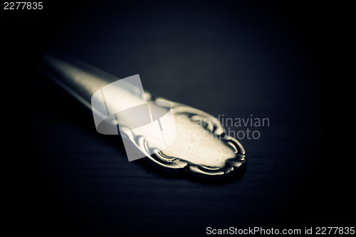 Image of Silver spoon closeup macro shot.