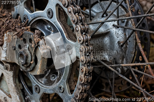 Image of Enduro motorbike wheel and chain. Closeup shot