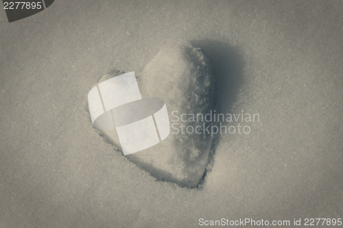 Image of Retro toned snow heart