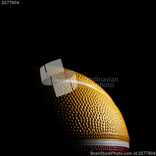 Image of Macro of a basketball isolated on black