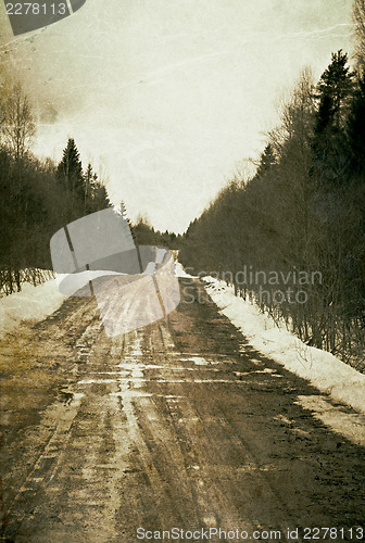 Image of Vintage depressed and deserted village road. Grunge background.