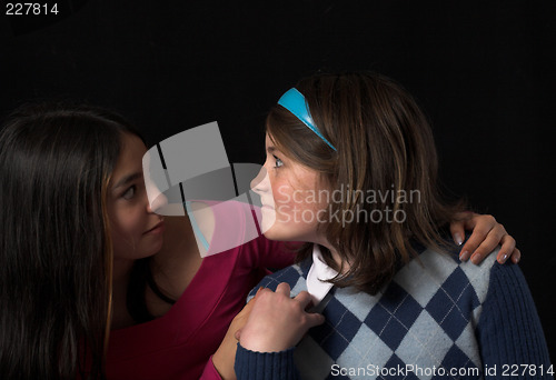 Image of teen posing over black backdrop