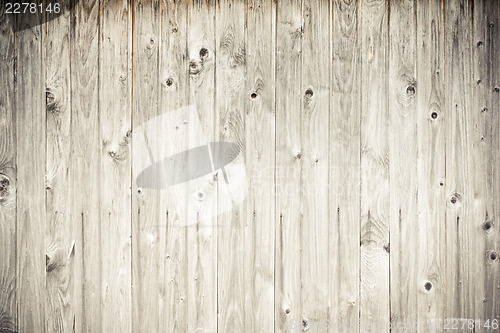 Image of weathered wood plank fence