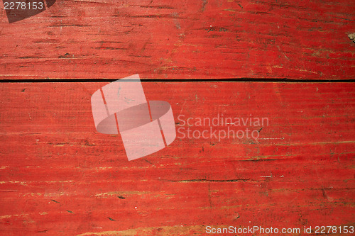 Image of Cracked red painted planks