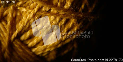 Image of Macro shot of a ball of string texture isolated on black