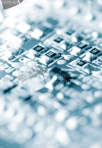 Image of Close-up of electronic circuit board, blue toned.