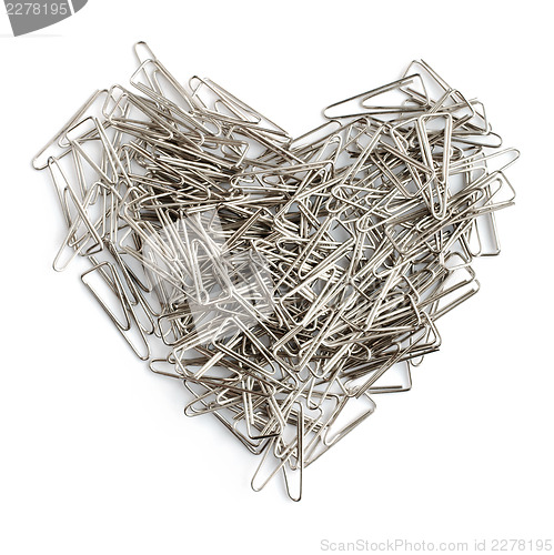 Image of Stationery love concept. Heart shaped staples background.